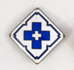 Apuhoitajamerkki.