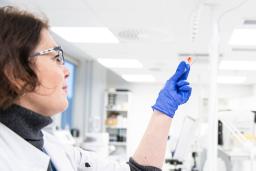 Biomedical Laboratory Scientist looking at a specimen.